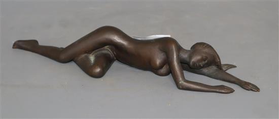 A bronze of a sleeping recumbent nude lady, length 28cm